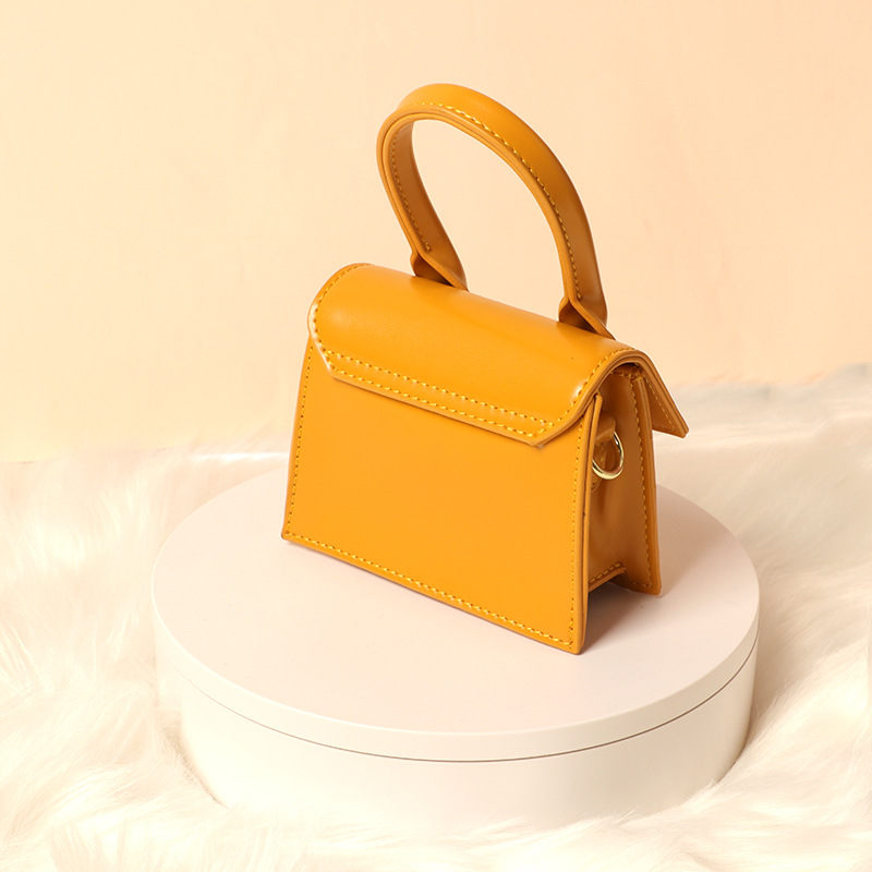 Small bag female 2022 new fashion slung simple scrub small concave shape yellow bag mini bag handbag