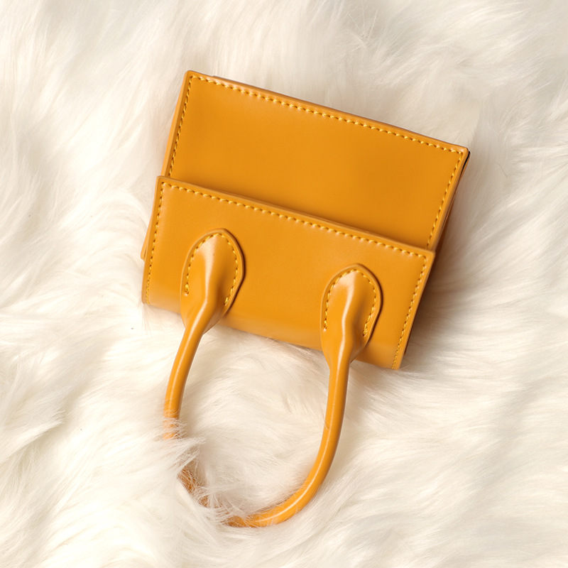 Small bag female 2022 new fashion slung simple scrub small concave shape yellow bag mini bag handbag